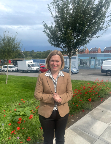 Rebecca stood outside Sherford primary school