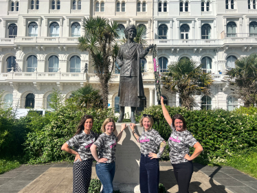 Rebecca poses with campaigners in front of Lady Aster statue